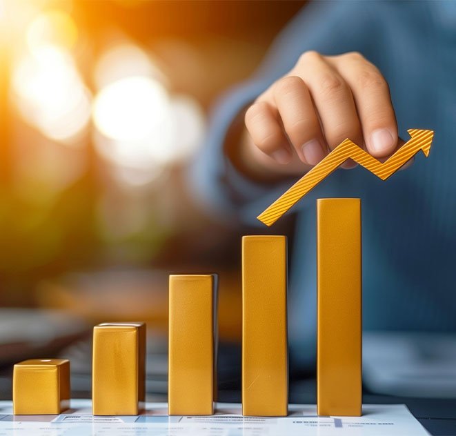 Hand placing upward arrow on golden bar graph, symbolizing growth and success in business acquisitions with Captyx.
