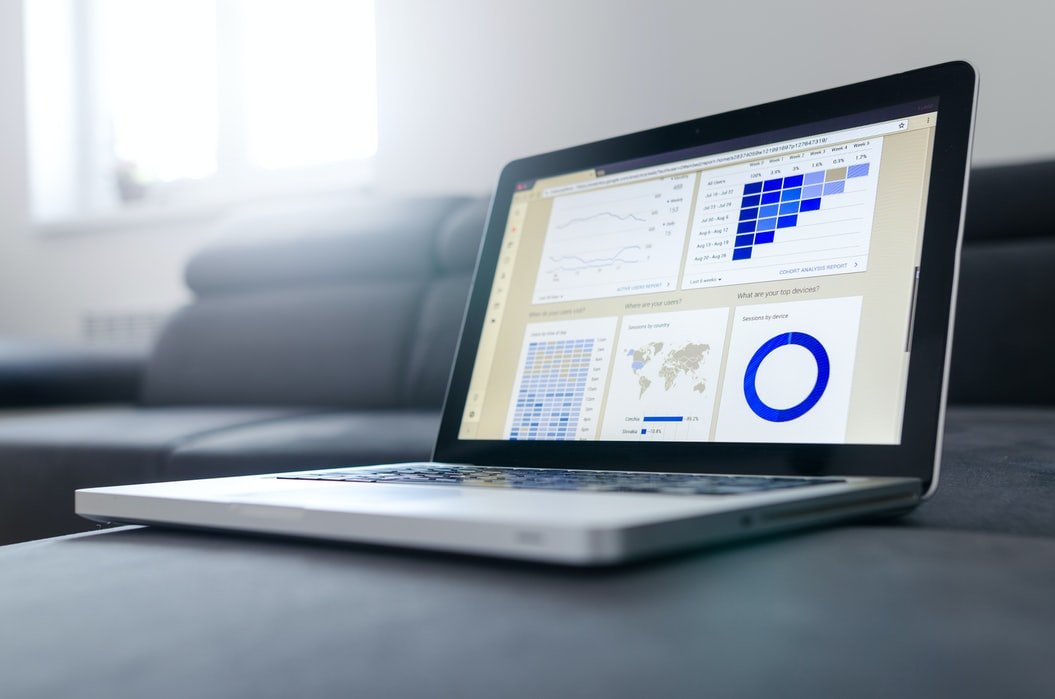 Laptop displaying business analytics and valuation data, emphasizing Captyx's services for free business valuations.