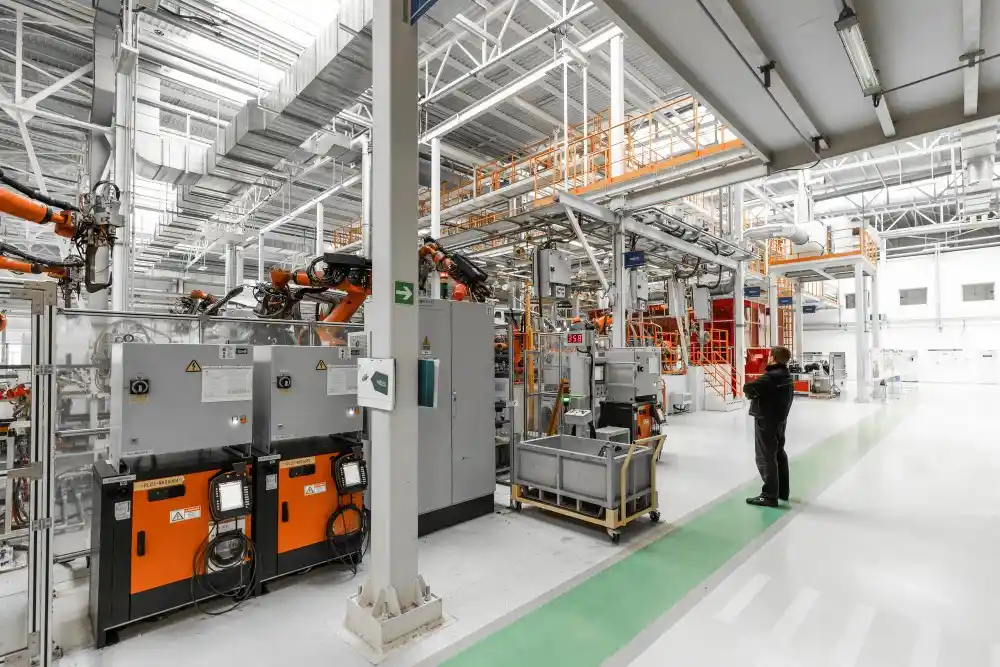 Industrial processing facility with robotic machinery and equipment, showcasing advanced technology for agricultural and materials processing.