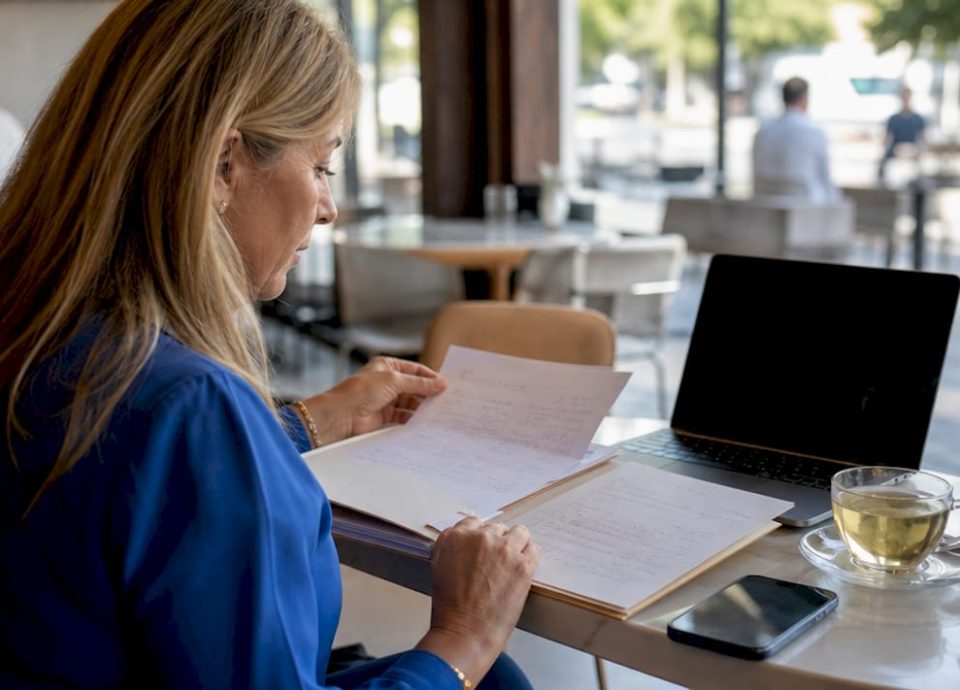 Entrepreneur reviewing buyer profile documents at home office