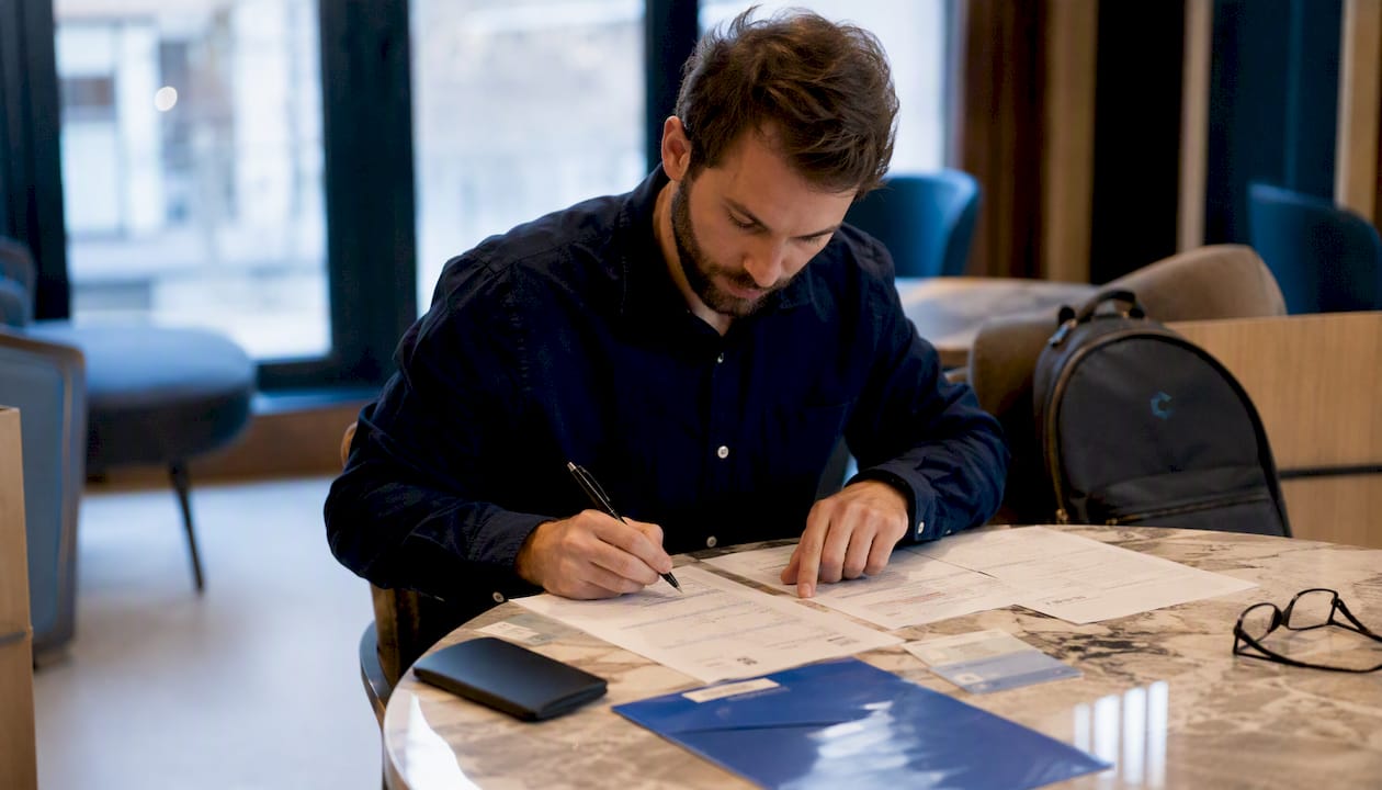 Close-up of hands checking buyer background documents