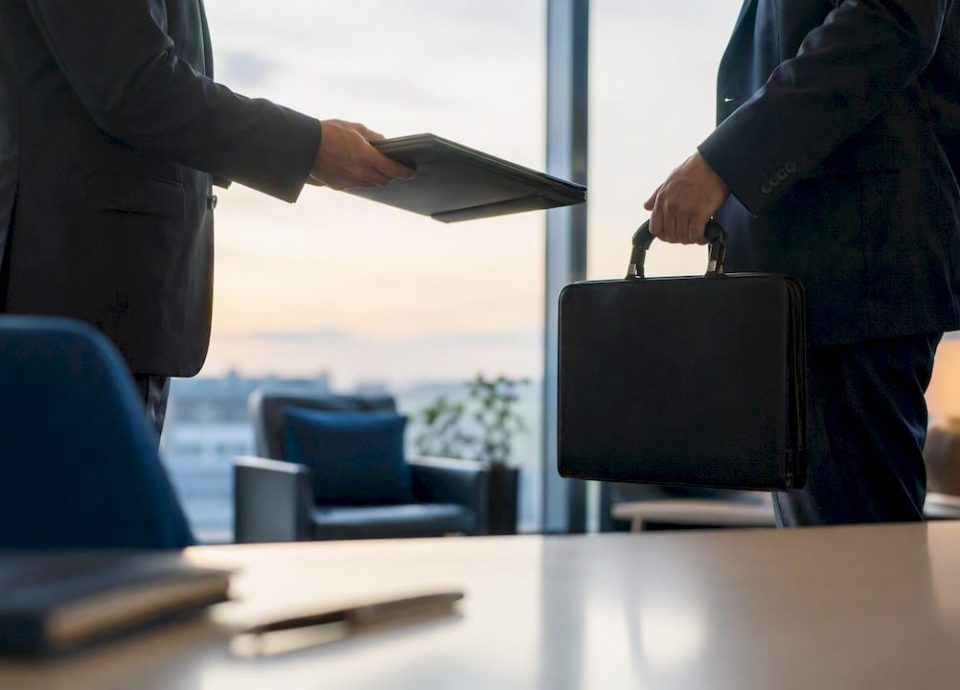 Close-up of business deal exchange objects