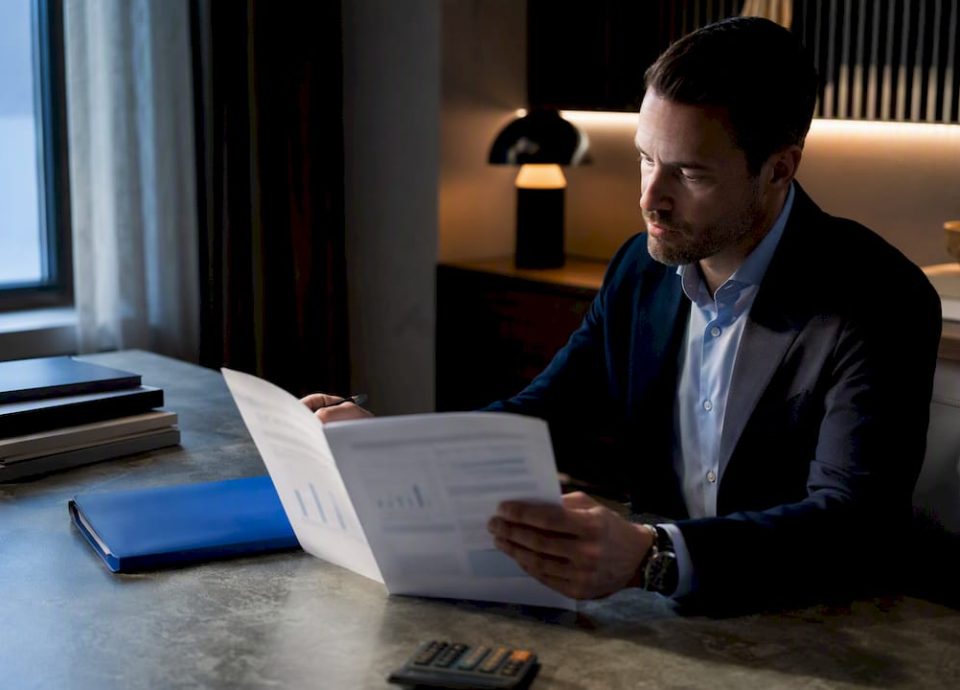 Advisor reviewing broker valuation materials