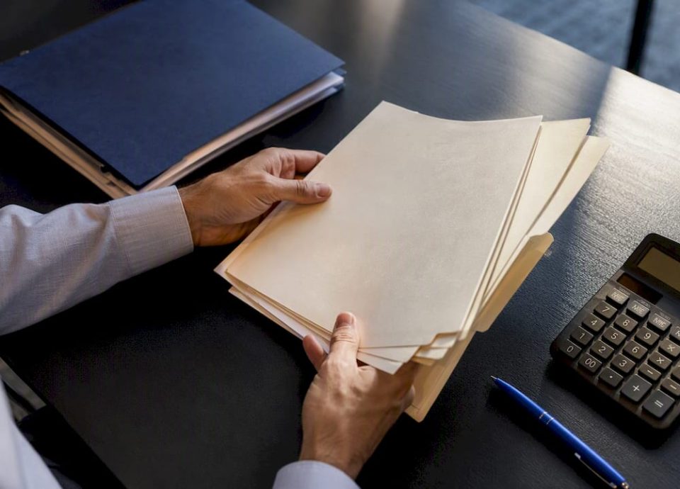Financial records being reconciled for normalized earnings
